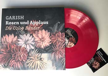 Rosen und Applaus auf rosa Vinyl